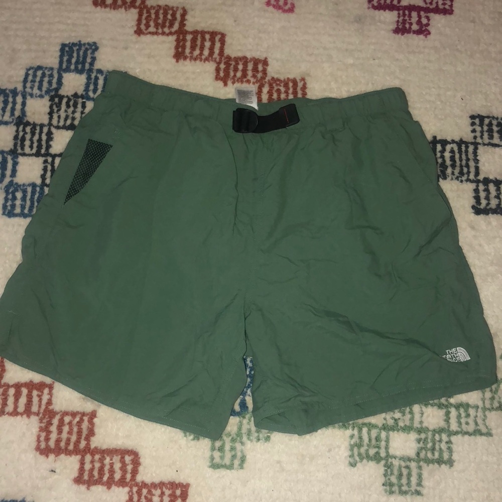 Green north face shorts with an adjustable belt